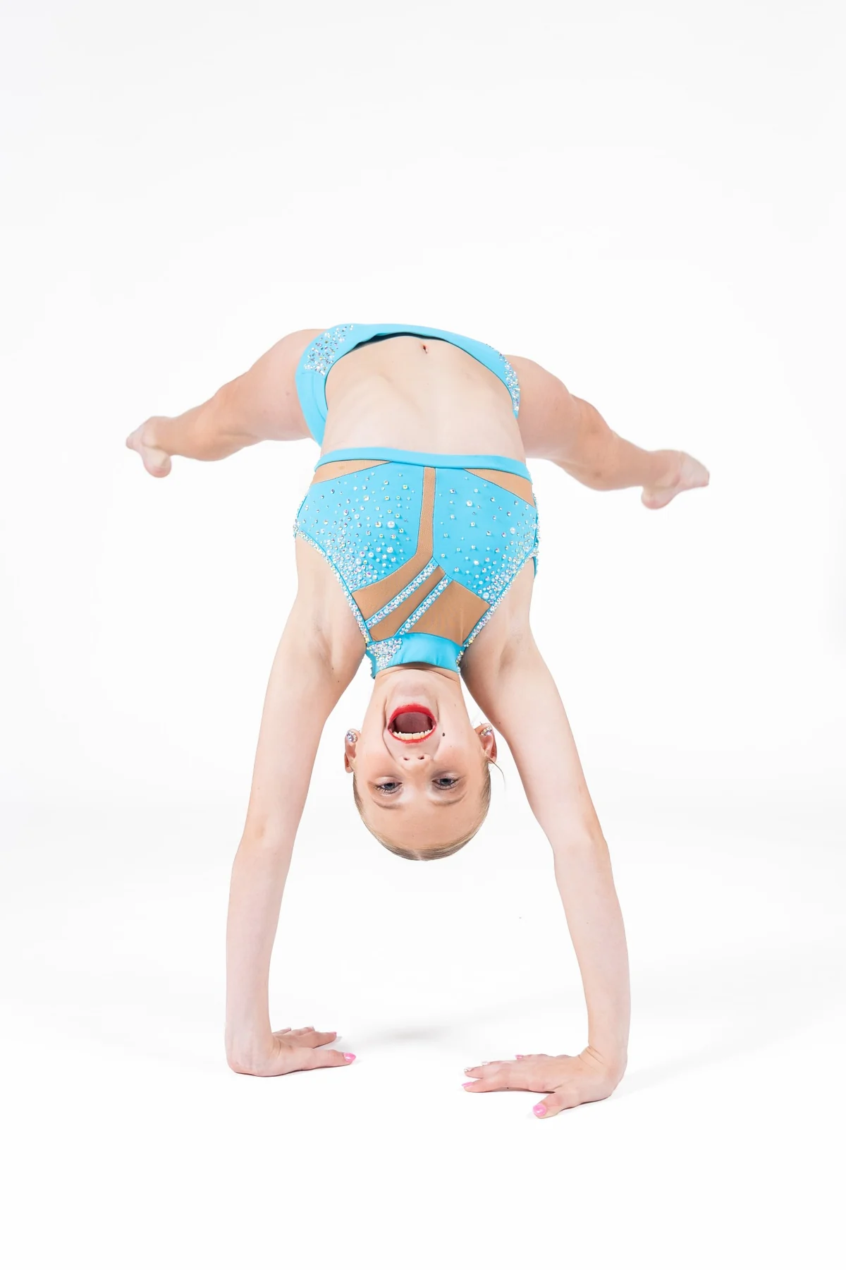 Young acrobatics student demonstrating balance, strength, and confidence