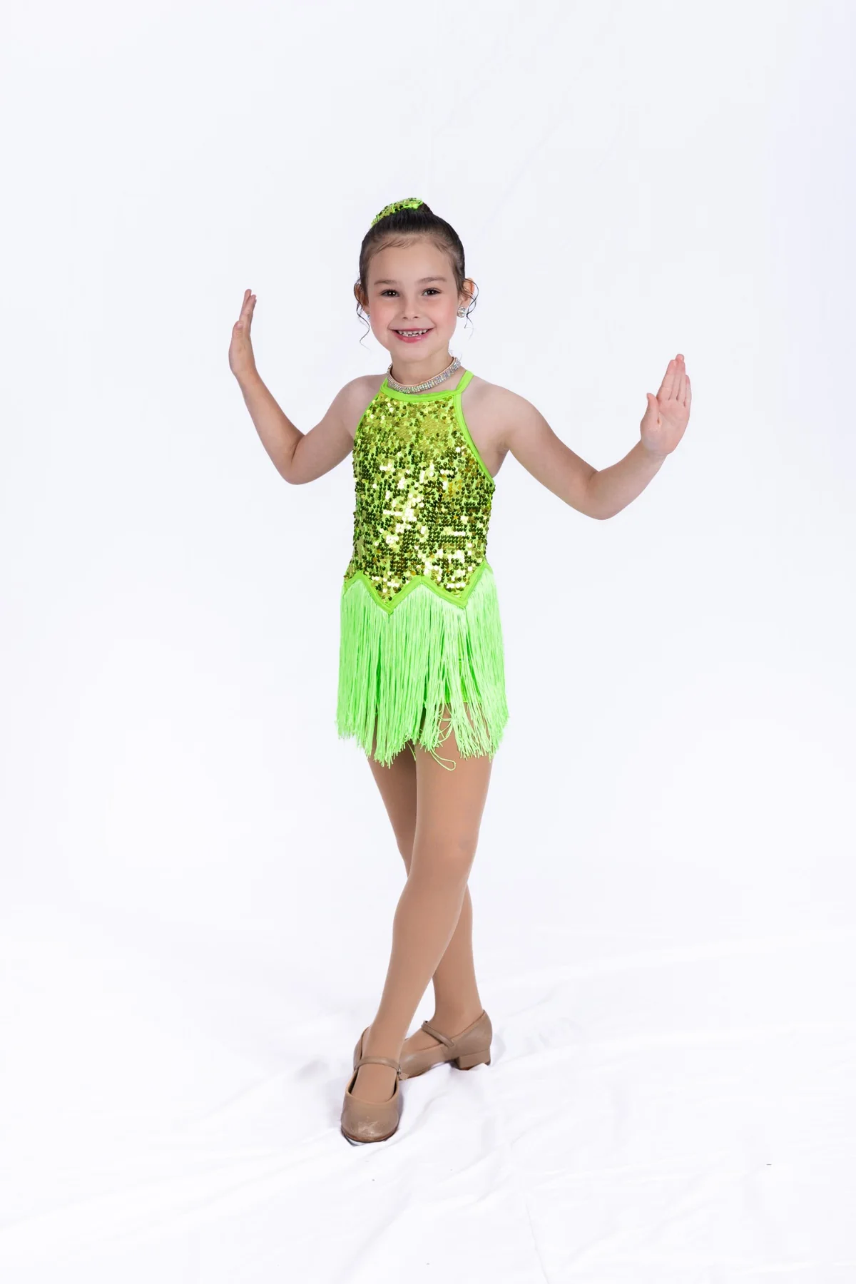 Young performer in a green costume