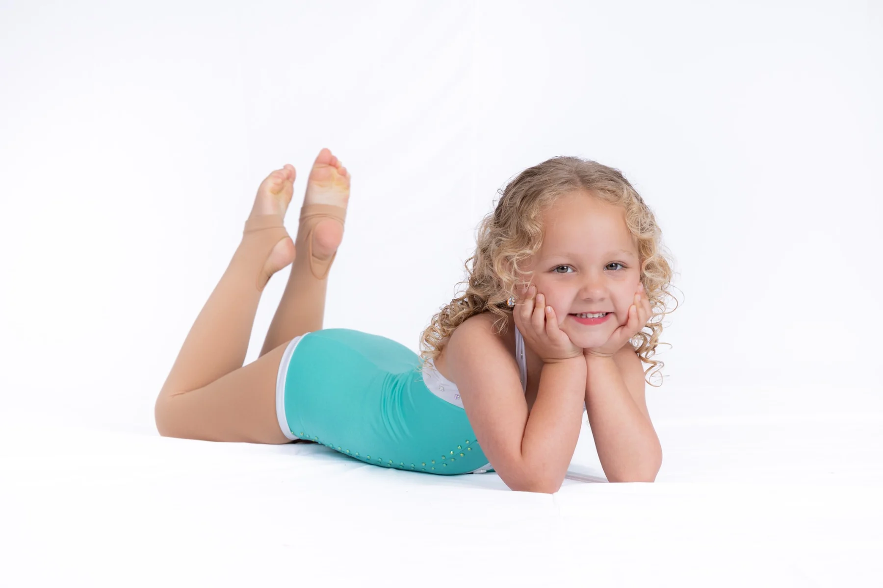 Young dancer smiling during an introductory movement portrait